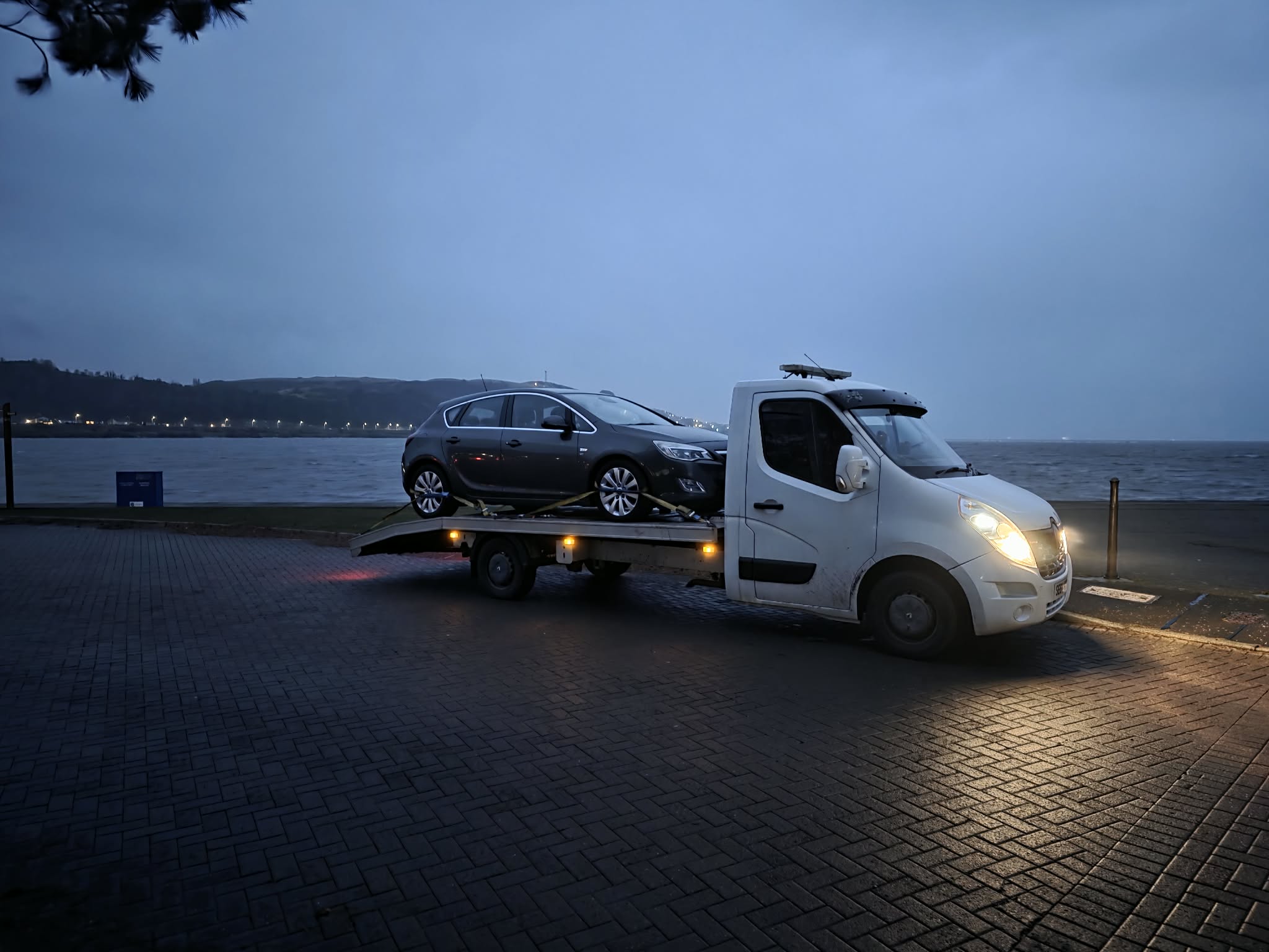 Dusk vehicle recovery by the waterfront in Fife