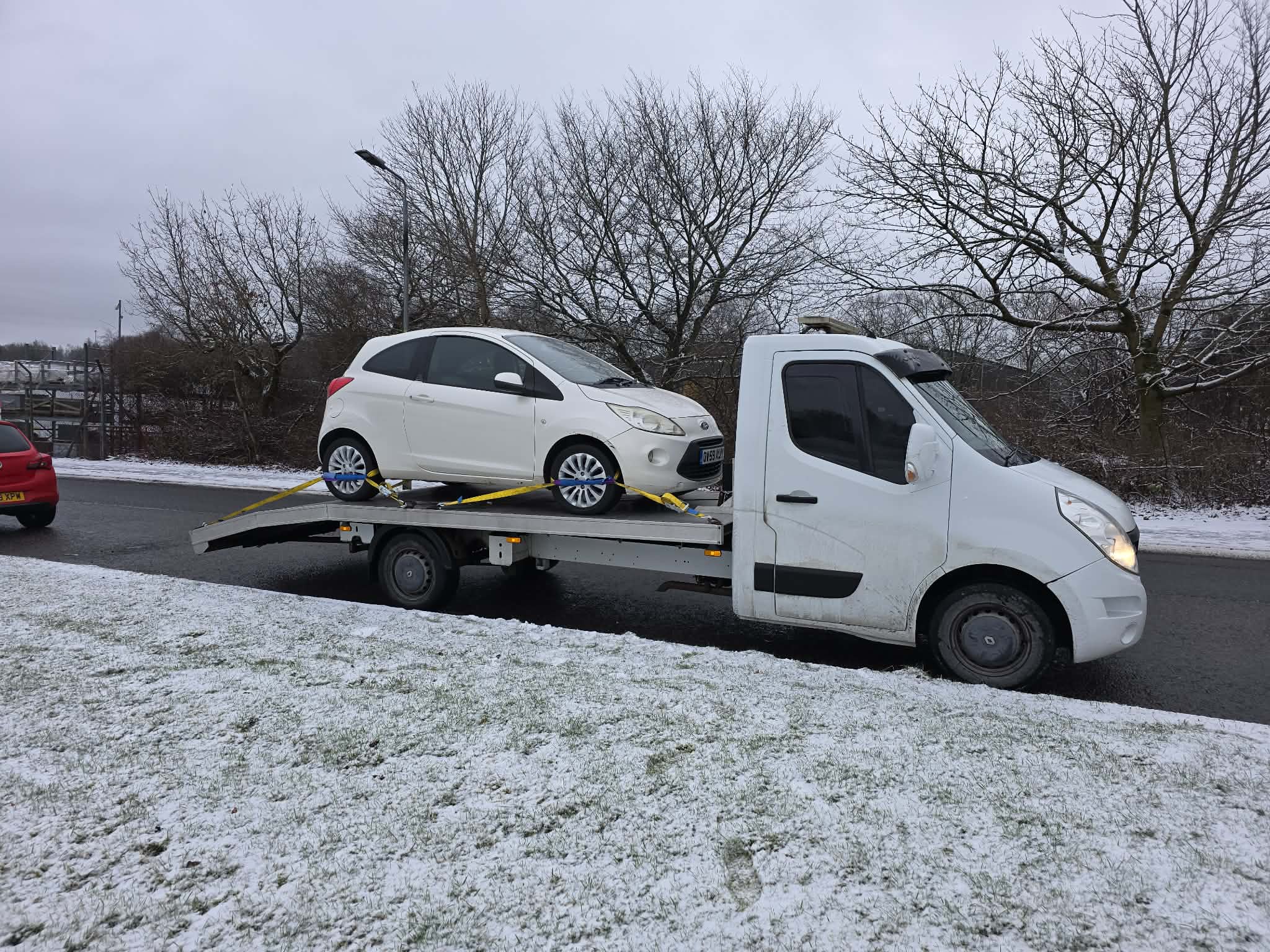 Vehicle recovery in snowy conditions on a country road in Fife